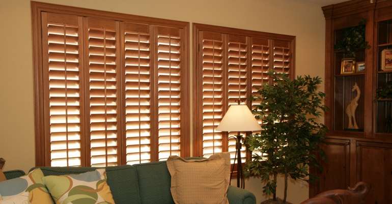 Natural wood shutters in Austin living room.